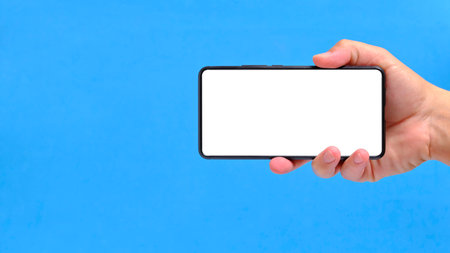 Hand blue background holds smartphone with clean white screen