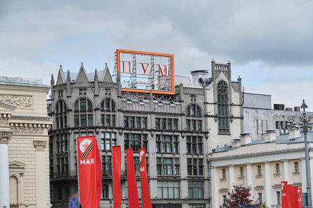 Moscow Russia 11.05.2023.Building Central Department Store, Central Department Store against background red flags installed for celebration ninth Mayのeditorial素材