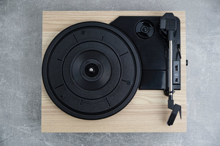 Vinyl record player top view gray background