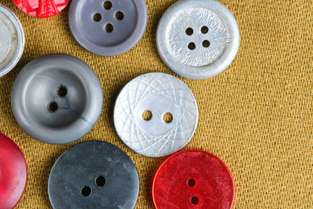 Buttons for clothes background brown fabric