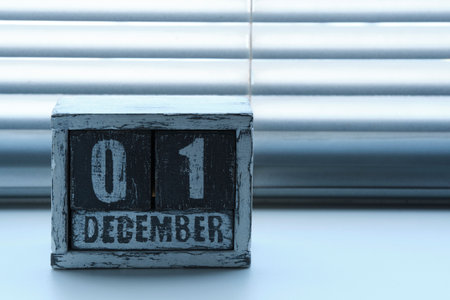 Morning December 01 on wooden calendar standing on window with blindsの写真素材