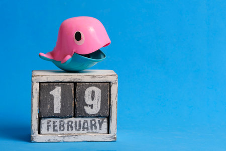 February 19th on Calendar and whale on blue background. World Marine Mammal Protection Dayの写真素材