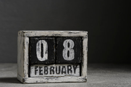 February 08 on wooden calendar, on dark gray backgroundの写真素材
