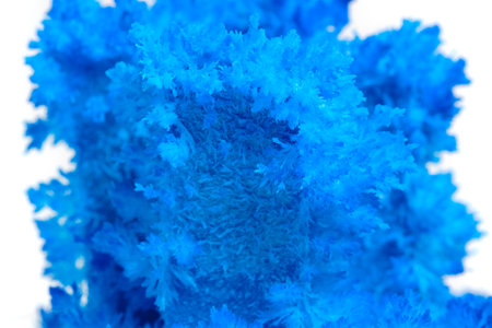 Macro image blue salt crystal on white background