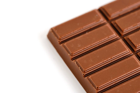 Bar of milk chocolate white background