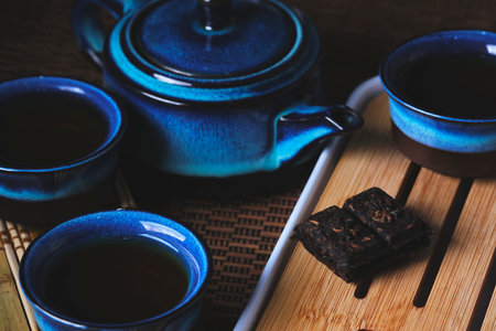 Tableware for tea ceremony . Blue tea set pottery on bamboo napkinの写真素材