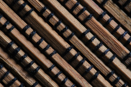Brown background made of braided wooden slats