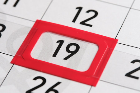Calendar date. The 19th number the calendar is highlighted in a red frameの写真素材