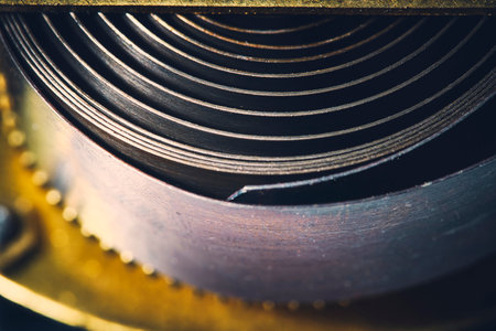 Background with a cocked mechanical springの写真素材