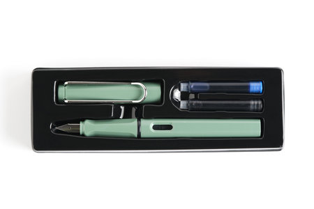 Green fountain pen in a package on a white background