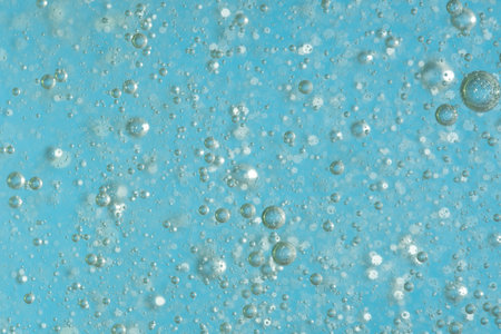 bubbles in the water on a blue background. close-up