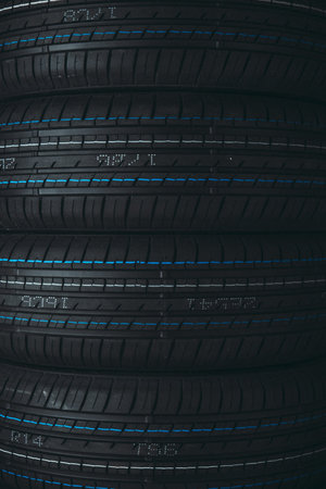 Car tires stacked in a row with blue lines. 3d rendering