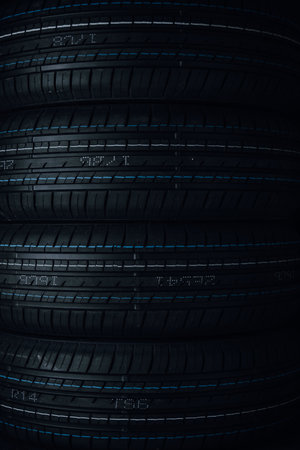 3d rendering of a set of auto tires in black with blue light