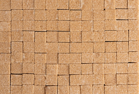 Brown sugar cubes as a background. Top view. Close up.の写真素材