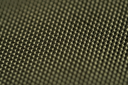 Close-up of a textured carbon fiber background. Macro.の写真素材