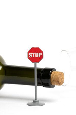 Stop sign and bottle of wine isolated on white background. 3D illustration.の写真素材