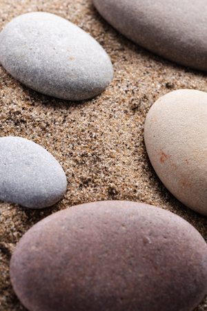 zen stones on the sand, concept of meditation, relaxation and meditation
