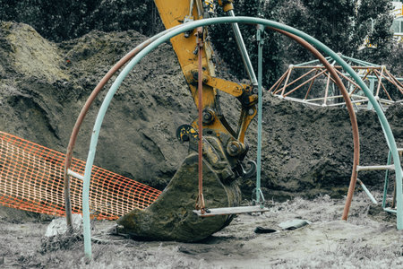 excavator machine working at construction site. excavator bucket close upの写真素材