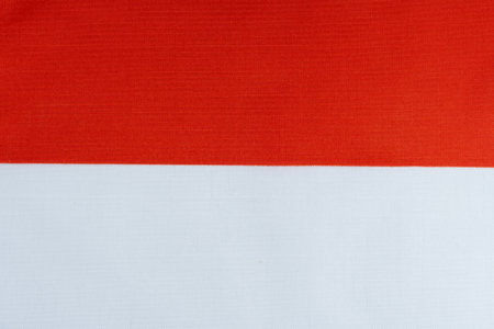 Indonesian flag fabric texture background. Flag of Indonesia is a state symbol of Indonesia.の写真素材