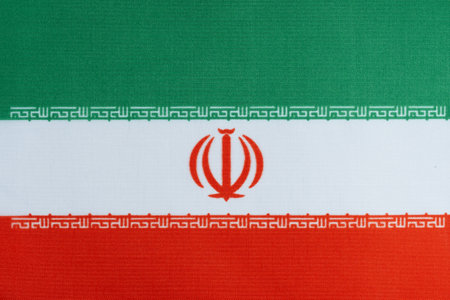 Iran national flag or symbol of the country. Fabric textured background.の写真素材