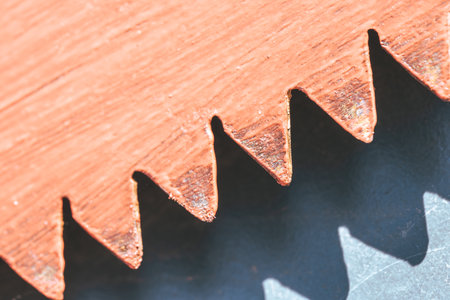 Close-up of an old saw blade. Shallow depth of field.の写真素材