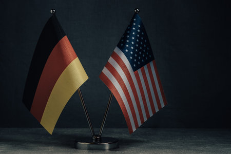 Table flag  United States America and National Flag Germany on dark background.の写真素材