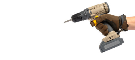 Cordless drill in hand isolated on white background with copy space