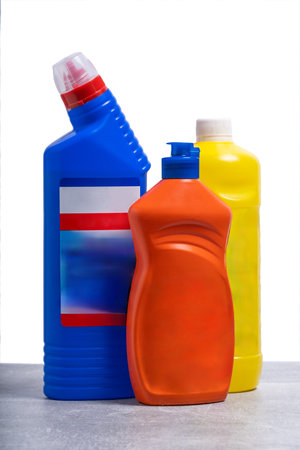 Plastic bottles of cleaning products on a white background. Detergent, bleach, dishwashing liquidの写真素材