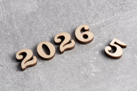New Year 2026 with wooden numbers on   grey background. Copy space.の写真素材