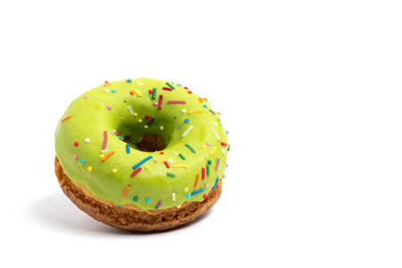 Green glazed donut isolated on white background with clipping path.の写真素材