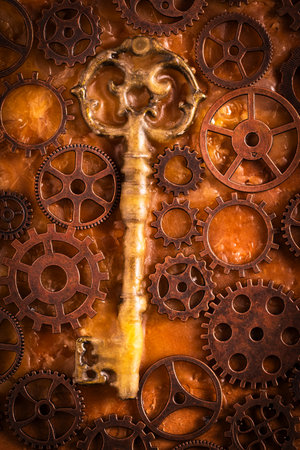 Antique key with gears. Tinted.の写真素材