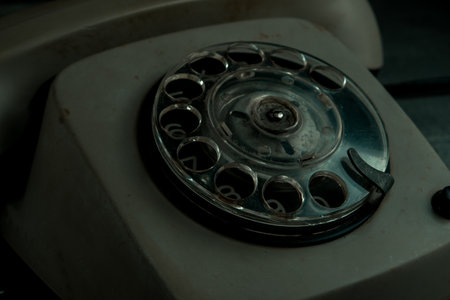 Old rotary telephone on a black background. Selective focus.の写真素材
