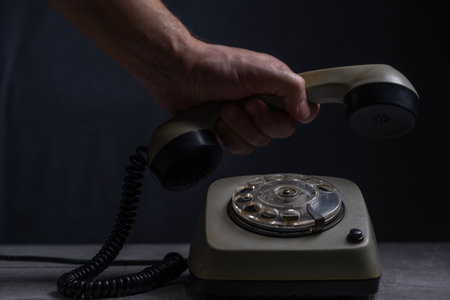 Old phone on wood background with filter effect retro vintage style and soft focusの写真素材