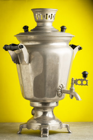 Samovar on a yellow background. Russian samovar.の写真素材