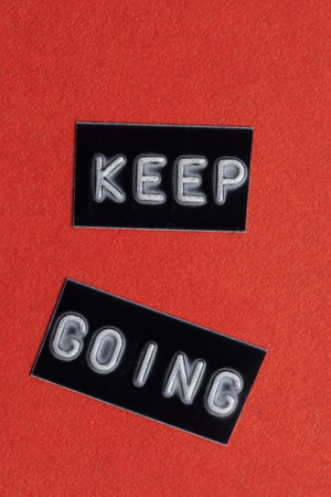 Keep going words on black and red background. Motivational and inspirational quote.の写真素材