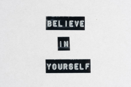 Believe in yourself text on white paper background. Conceptual image.の写真素材