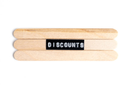 Word on wooden popsicle sticks on white background.の写真素材