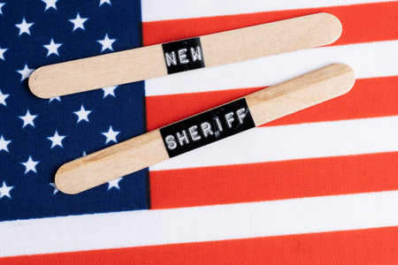 United States America flag with words on wooden sticks.