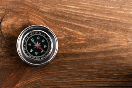 Compass on a wooden background with copy space for your text.の写真素材