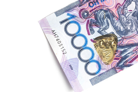 Banknotes of Kazakhstan tenge with face value of ten thousand closeup. Highlighted on white...