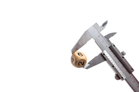 Caliper with wooden cube and dice, isolated on white background