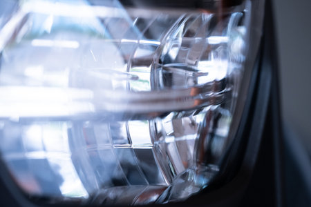 Closeup  headlight modern car. Abstract futuristic background.
