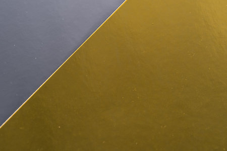 Gold and gray background with dedicated space for text or image. Abstract background