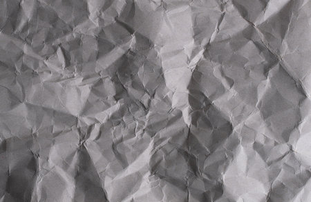 Crumpled grey paper background. Crumpled paper texture.の写真素材