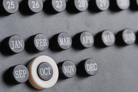 Stylish black calendar with dates marked.の写真素材