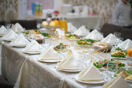 Wedding Banquet Table with Plates and Tablecloths.の写真素材