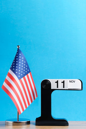 November 11 is Veterans Day. Calendar is wrapped with flag United States America. Space for text.の写真素材