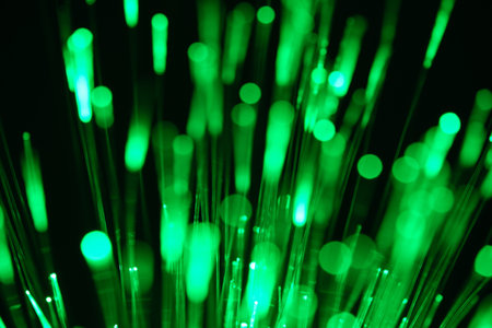 fiber optical network cable in green light abstract macro close-up