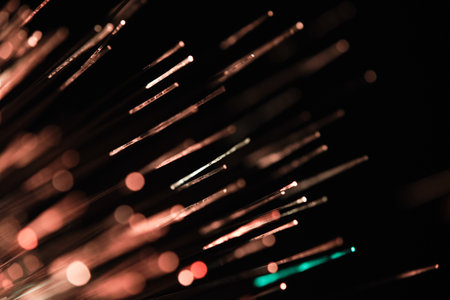 Abstract bokeh background of fiber optic light strands. Technology background.