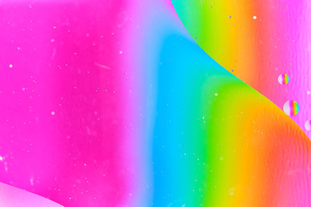 Artistic macro view colorful oil droplets in water, creating unique, vibrant geometric shapesの写真素材